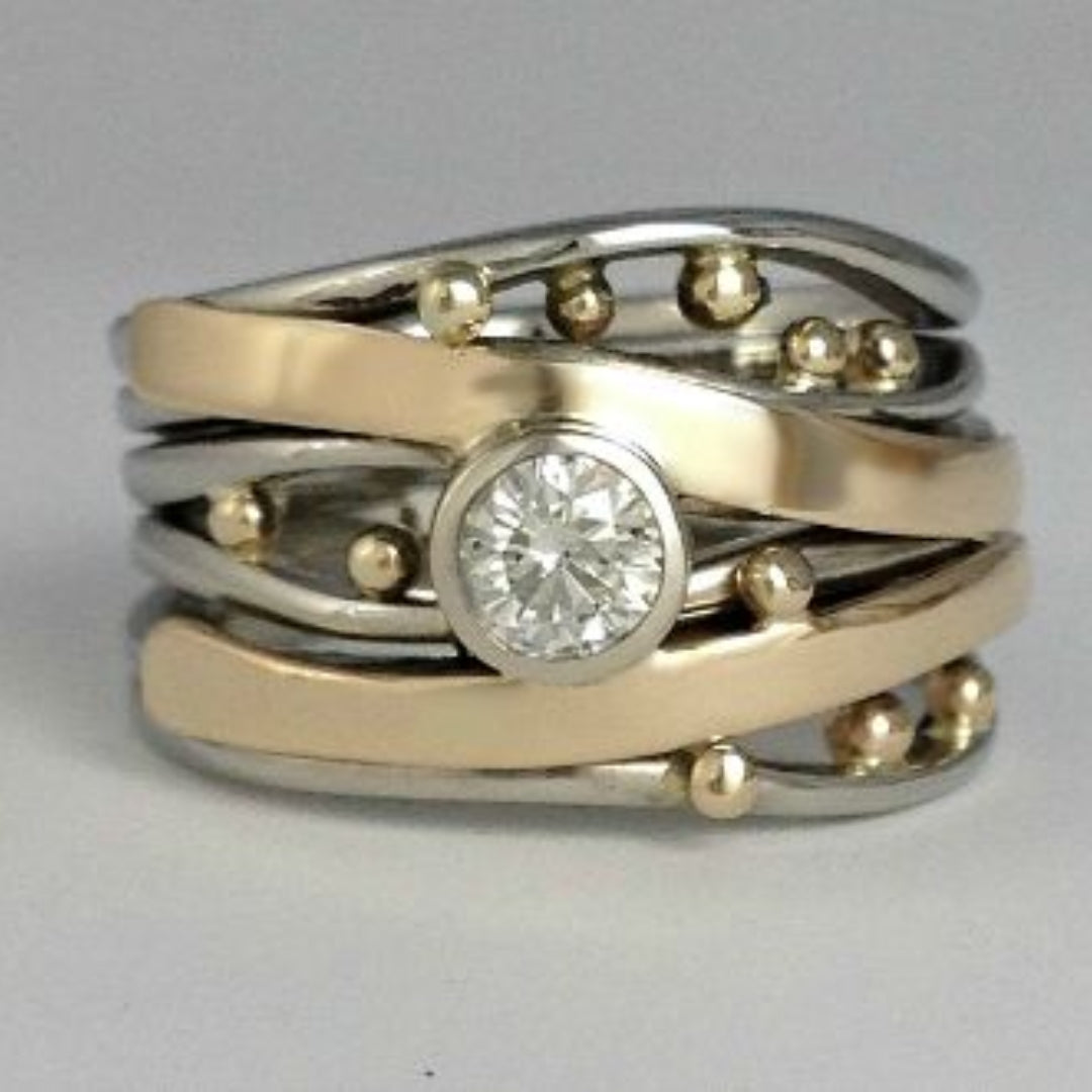 Anillo con Circonita en Oro y Plata